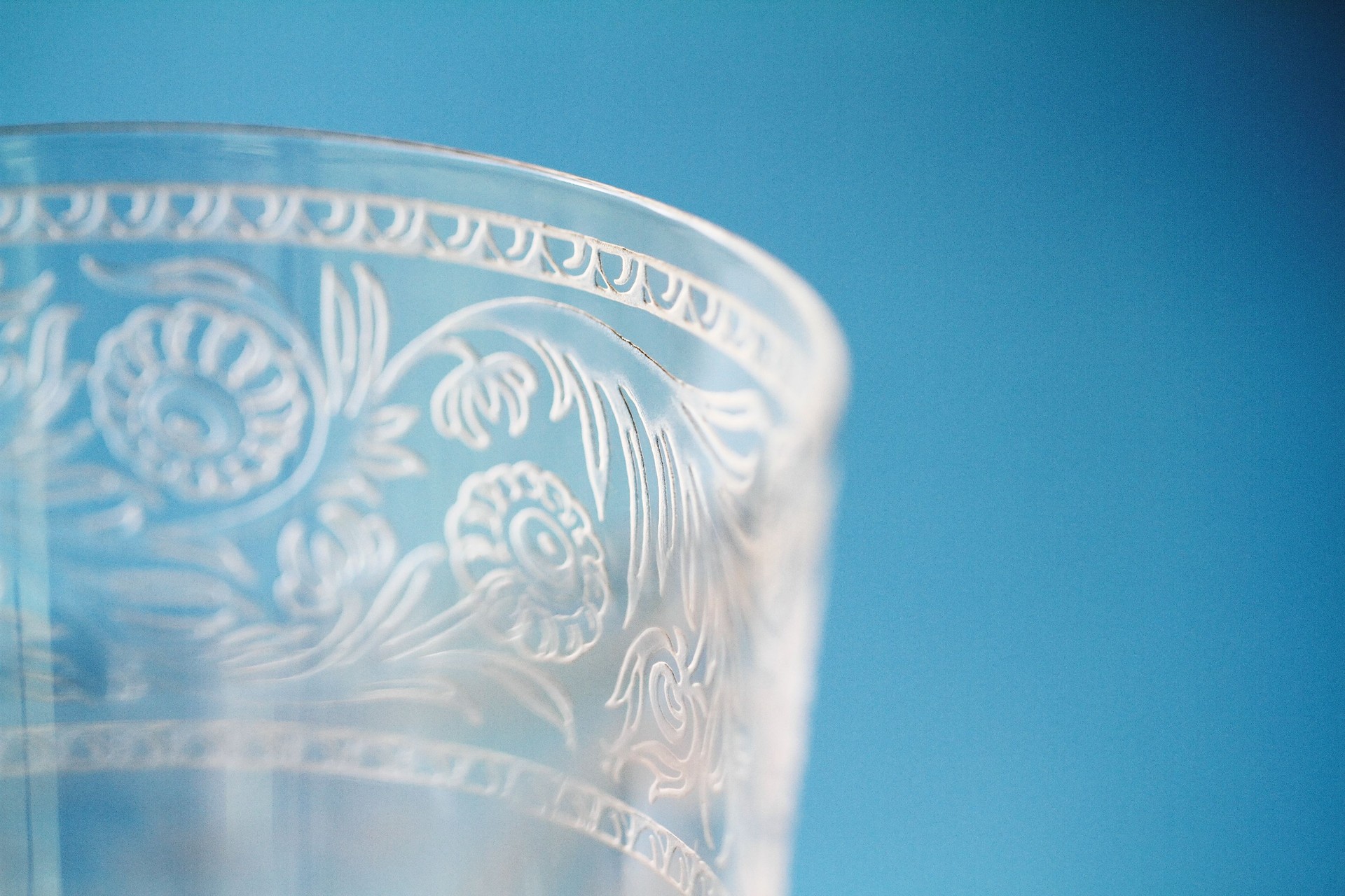 Macro closeup of etching on wine goblet crystal glass